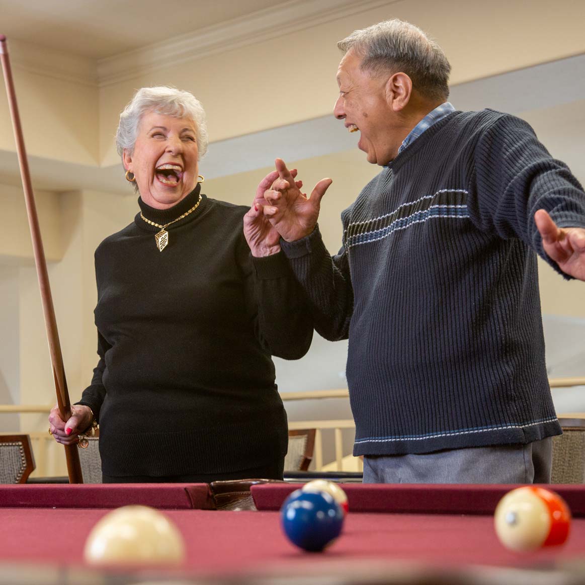 Residents playing billiards at Summit Glen